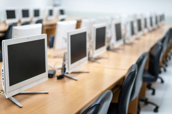 Computers in classroom in lecture room.